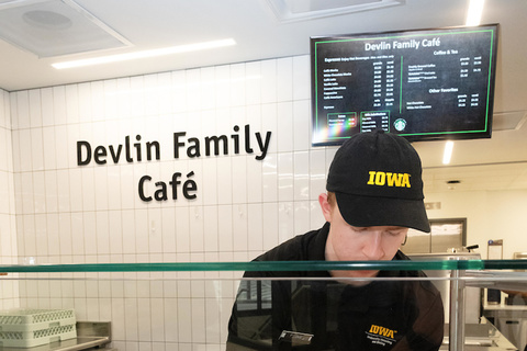 A person working behind the counter at the Devlin Family Cafe