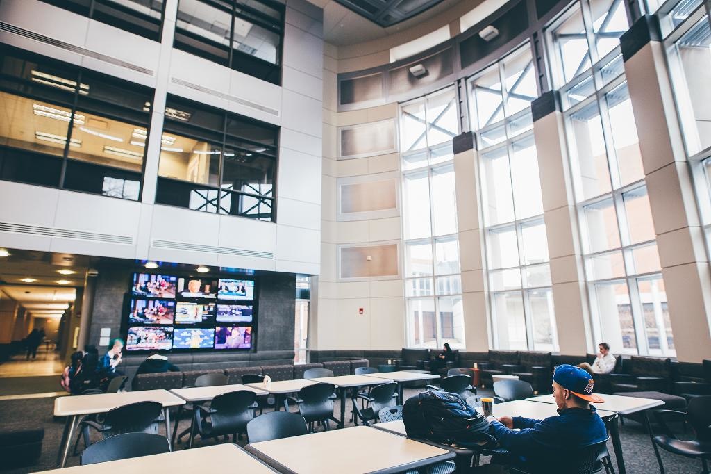Students studying in the Adler building atrium