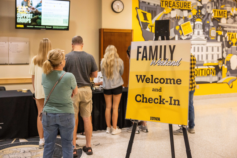Families check in to event in the IMU building