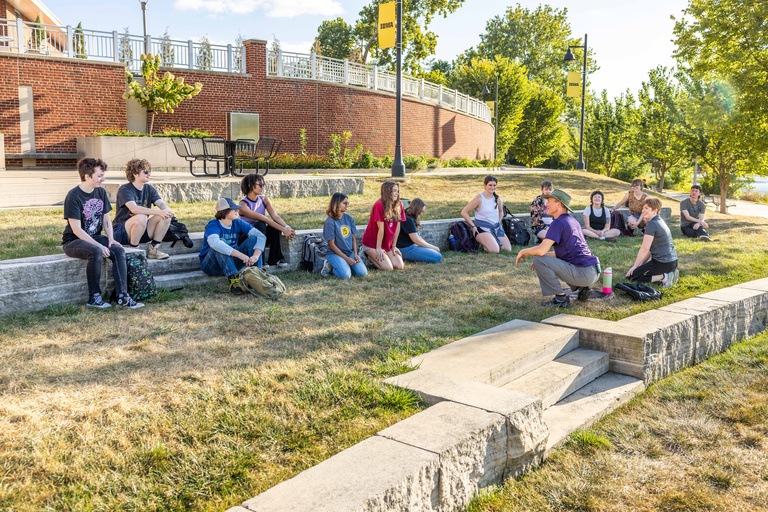 iowa students sitting ouside along the river terrace