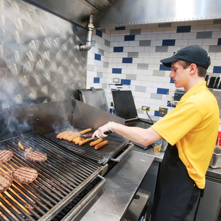 Student working the grill at Catlett
