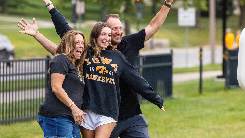 Families take photos with Herky, play yard games, and enjoy food from local food trucks during Family Weekend.