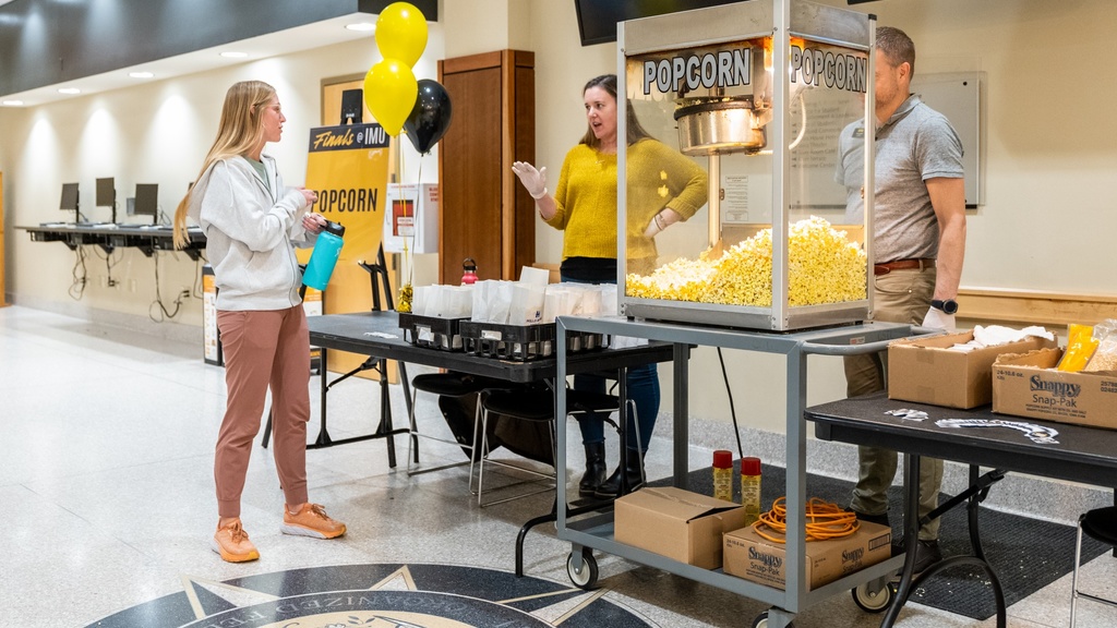 People serving popcorn in the IMU