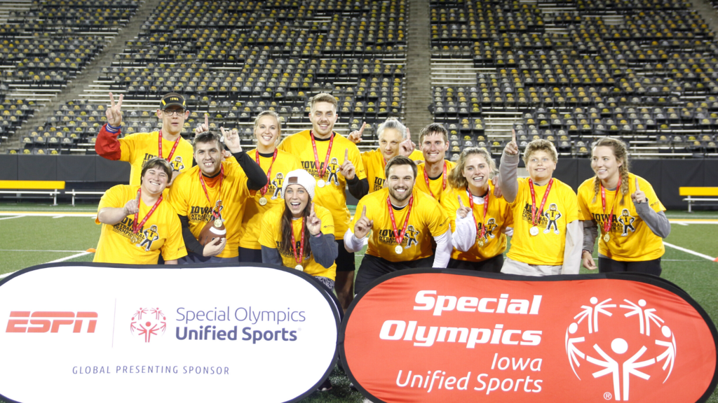 A group of people celebrating at the Special Olympics