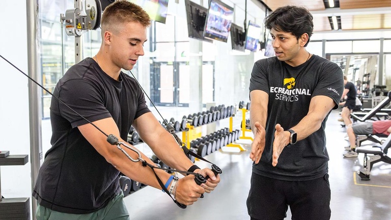 Personal trainers educate and guide their clients during training sessions